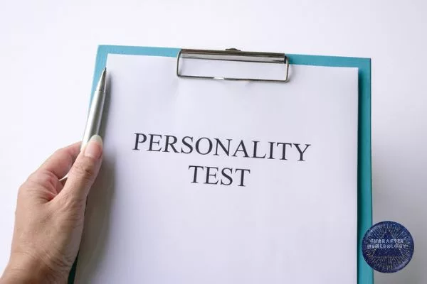 Personality Test Comparison - Personality Test paper on blue clipboard