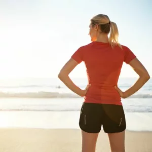 Character Numerology Discovery-Sporty woman looking at the ocean
